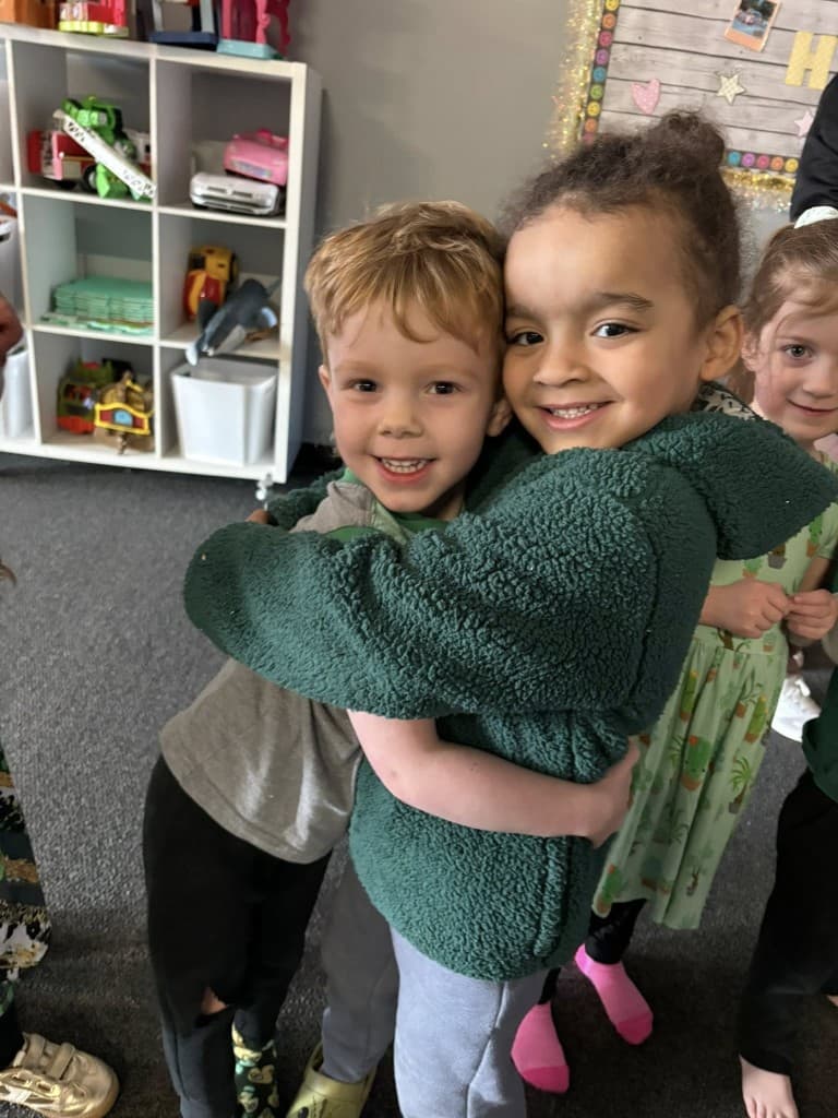 Two children hugging