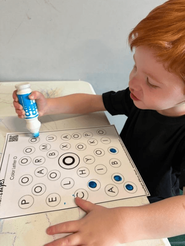 Child working on a letter activity